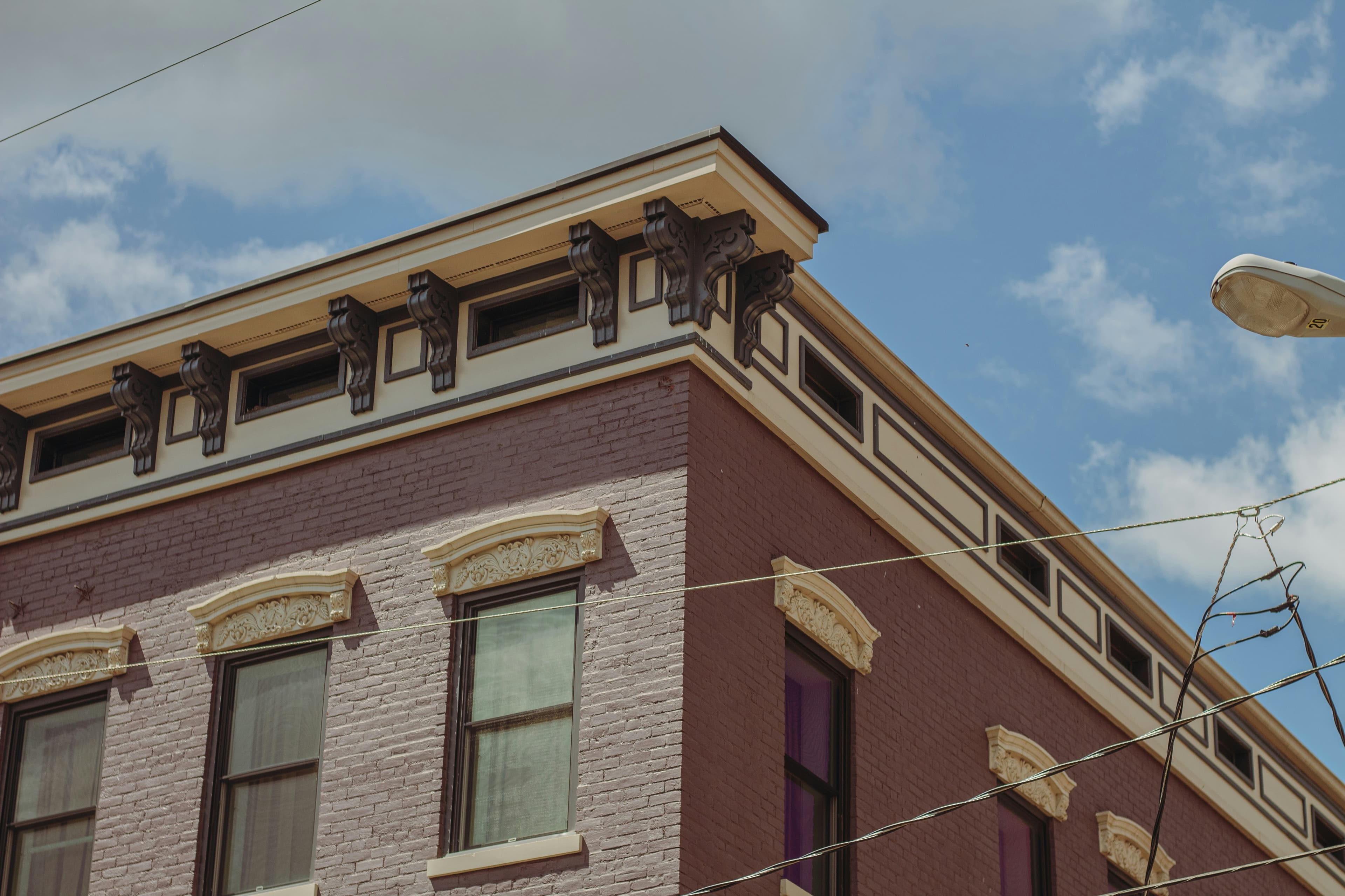 Classic brick facade with ornate cornices on a Midwest main street